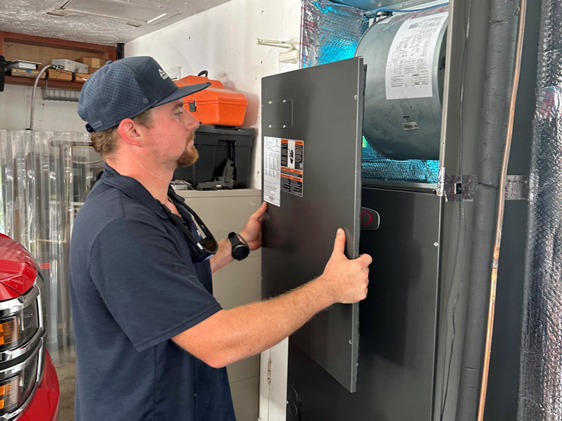 Airtech-IAQ-808×606 Airtech employee servicing a home hvac system