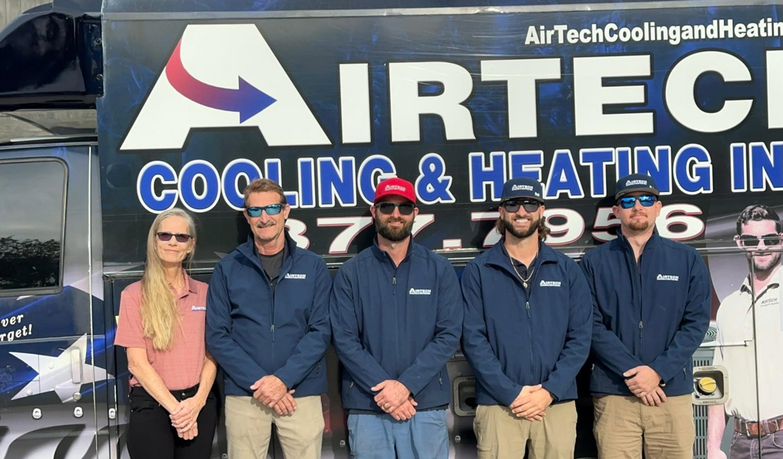 Airtech-Homepage-Hero-1105×650 Airtech team standing by their company van